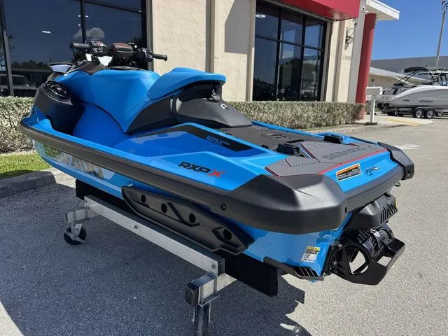 Slide: The Image of 2026 Sea-Doo RXP-X 325 in Gulfstream Blue on a trailer. - 6