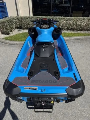 Slide: The Image of 2026 Sea-Doo RXP-X 325 in blue, side view on parking lot. - 8
