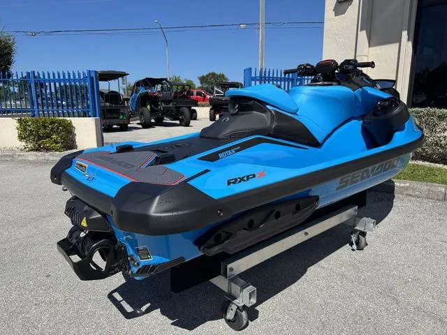 Slide: The Image of 2026 Sea-Doo RXP-X 325 in Gulfstream Blue, on a dolly. - 9