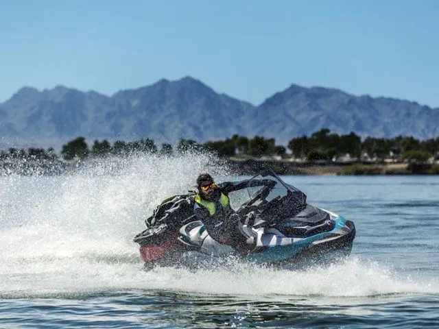 Slide: The Image of 2026 Sea-Doo GTX jet ski on water with mountain backdrop. - 3