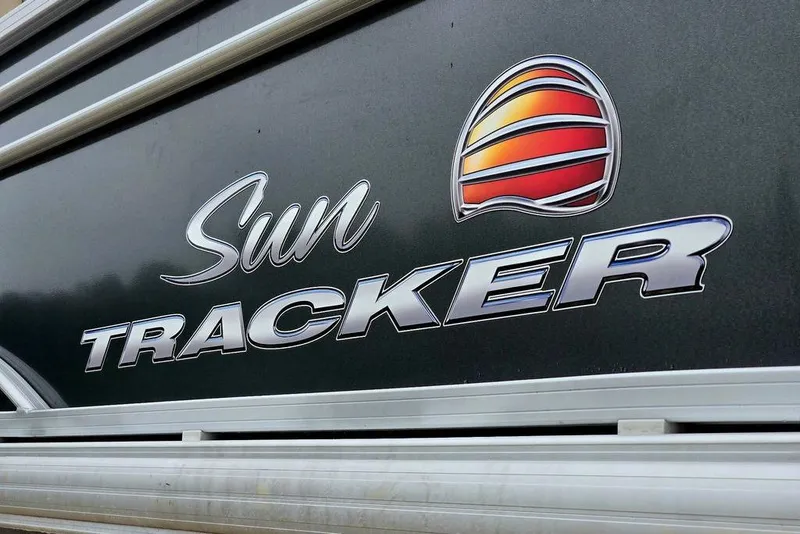 Slide: The Image of 2023 Sun Tracker Party Barge 20 DLX logo on boat exterior. - 5