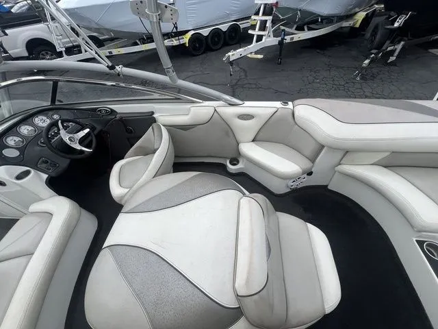 Slide: The Image of Interior of a 2008 Tigé 22i boat with gray and white seating. - 11