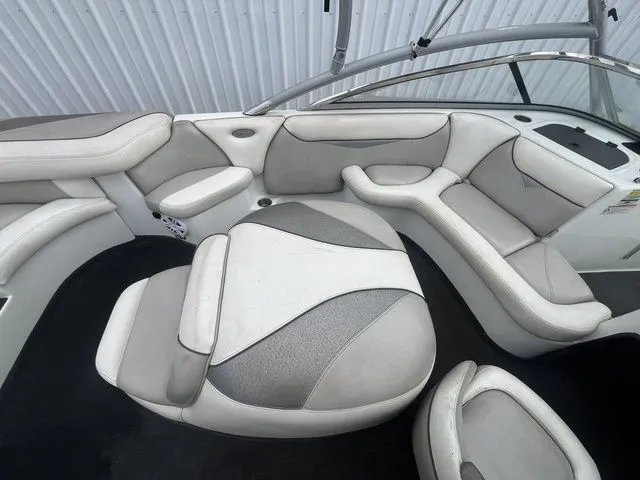 Slide: The Image of Interior of a 2008 Tigé 22i boat with gray and white seating. - 12