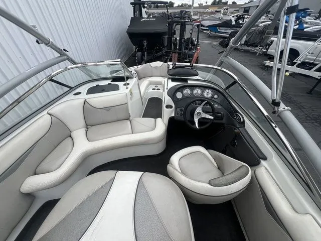 Slide: The Image of Interior of a 2008 Tigé 22i boat with gray upholstery. - 13