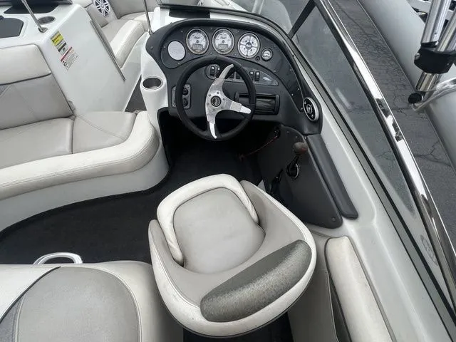 Slide: The Image of Interior of a 2008 Tigé 22i boat with steering console. - 14