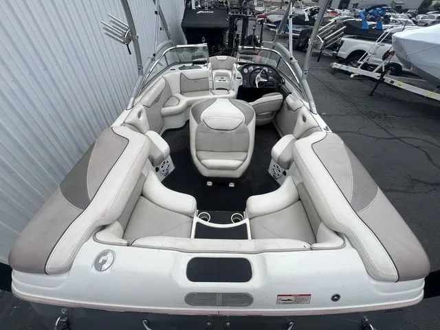 Slide: The Image of Interior view of a 2008 Tigé 22i boat with beige seating. - 17