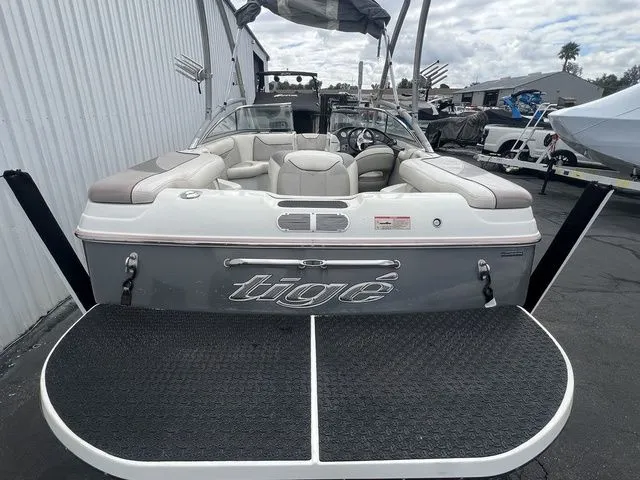 Slide: The Image of Rear view of a 2008 Tigé 22i boat in a parking area. - 3