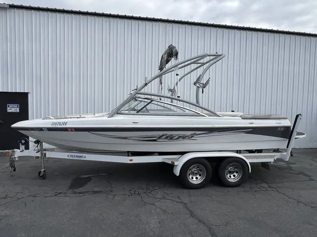 Slide: The Image of 2008 Tigé 22i boat on trailer in front of warehouse. - 5