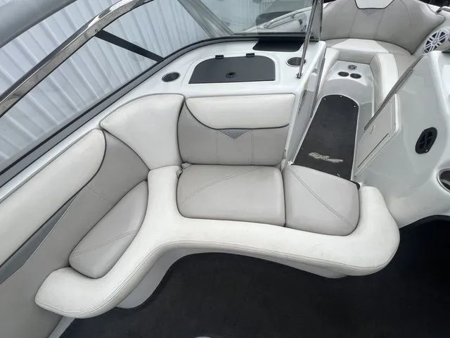 Slide: The Image of Interior of a 2008 Tigé 22i boat with white upholstery. - 8
