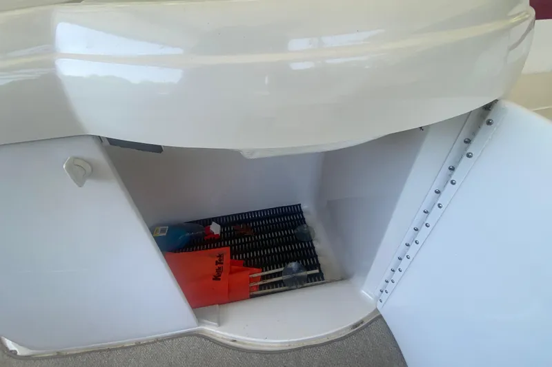 Slide: The Image of Open storage compartment on a 2001 Formula 330 Sun Sport boat. - 10
