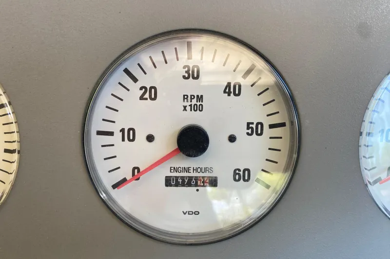 Slide: The Image of Tachometer of 2001 Formula 330 Sun Sport showing RPM and engine hours. - 14