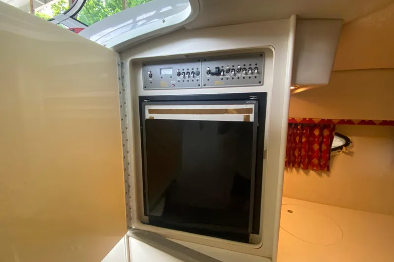 Slide: The Image of 2001 Formula 330 Sun Sport cabin interior with control panel and refrigerator. - 59
