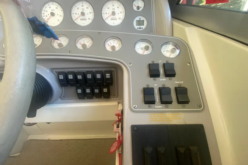 Slide: The Image of Dashboard of a 2001 Formula 330 Sun Sport boat with gauges and control switches. - 18