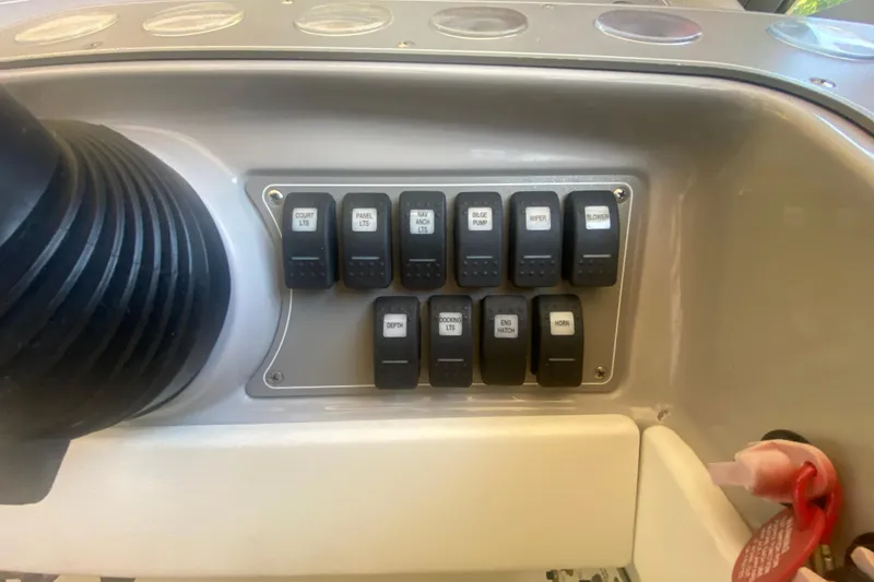 Slide: The Image of Control panel of a 2001 Formula 330 Sun Sport boat with labeled switches. - 19
