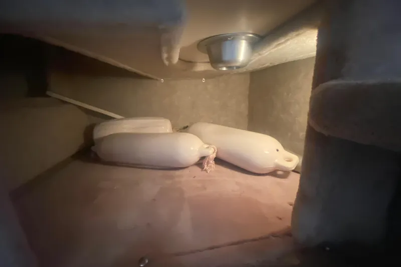 Slide: The Image of Storage compartment in a 2001 Formula 330 Sun Sport boat with fenders. - 21