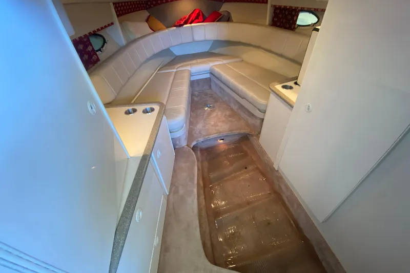 Slide: The Image of Interior of a 2001 Formula 330 Sun Sport boat with beige seating and carpet. - 22