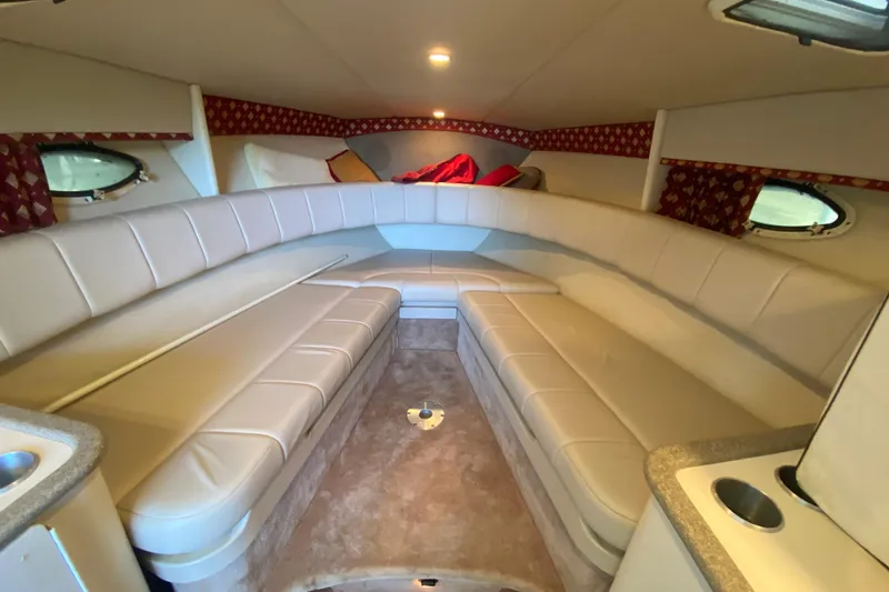 Slide: The Image of 2001 Formula 330 Sun Sport cabin interior with beige seating and red accents. - 23