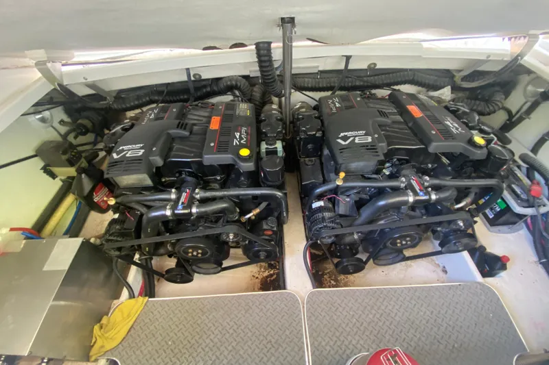 Slide: The Image of Twin Mercury V8 engines in a 2001 Formula 330 Sun Sport boat. - 27