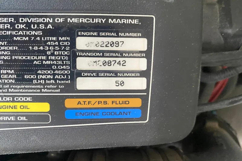 Slide: The Image of Label on Mercury Marine engine, showing serial numbers and fluid color codes for a 2001 Formula 330 Sun Sport. - 29