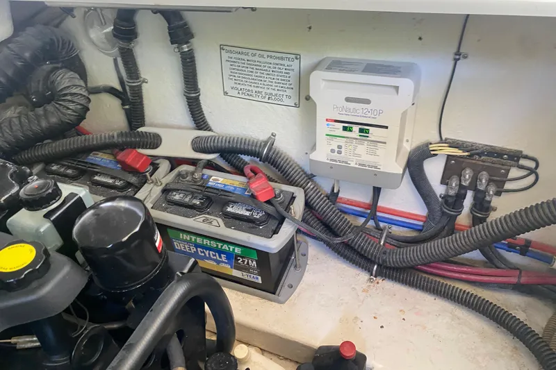 Slide: The Image of Engine compartment of 2001 Formula 330 Sun Sport with batteries and ProNautic charger. - 30