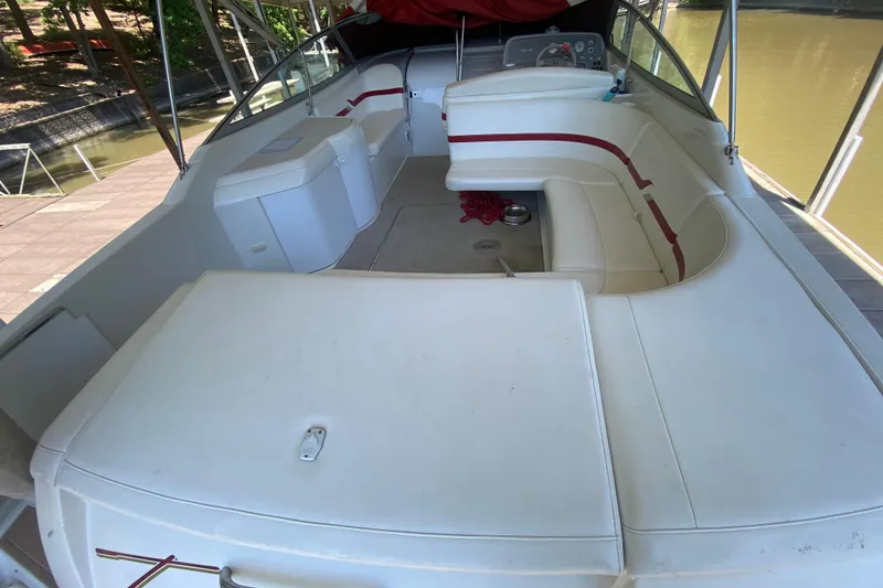 Slide: The Image of 2001 Formula 330 Sun Sport boat interior with white seating and red accents. - 31