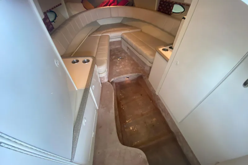 Slide: The Image of Interior of a 2001 Formula 330 Sun Sport boat with beige seating and compact design. - 56