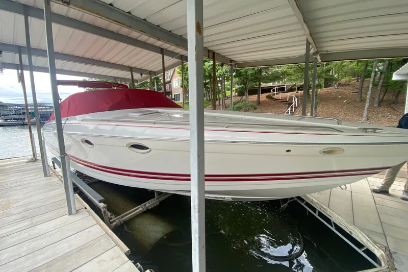 Slide: The Image of 2001 Formula 330 Sun Sport boat docked under covered marina. - 53