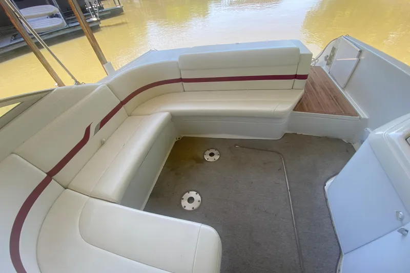 Slide: The Image of 2001 Formula 330 Sun Sport boat interior with white seating and red accents. - 5