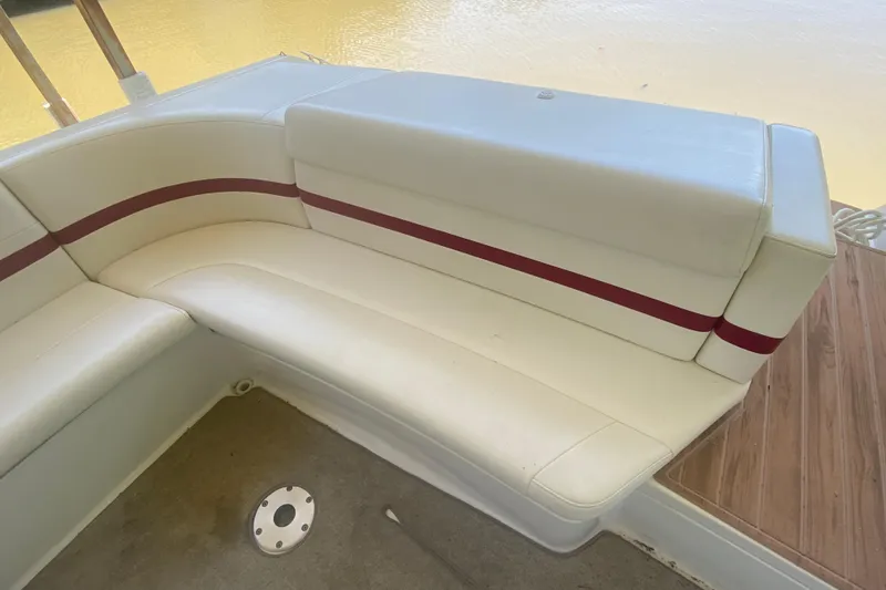 Slide: The Image of 2001 Formula 330 Sun Sport boat interior with white seating and red accents. - 6
