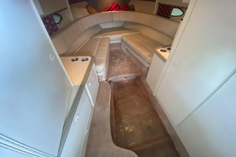 Slide: The Image of Interior of a 2001 Formula 330 Sun Sport boat, featuring beige seating and compact design. - 55