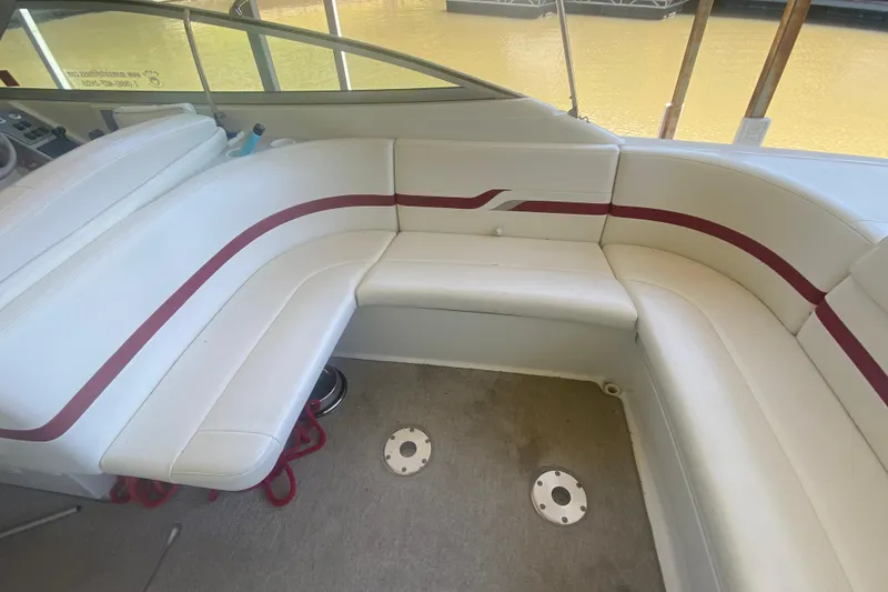 Slide: The Image of Interior seating of a 2001 Formula 330 Sun Sport boat with white and red upholstery. - 7