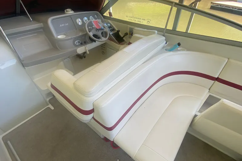 Slide: The Image of Interior of a 2001 Formula 330 Sun Sport boat with white seating and dashboard. - 8
