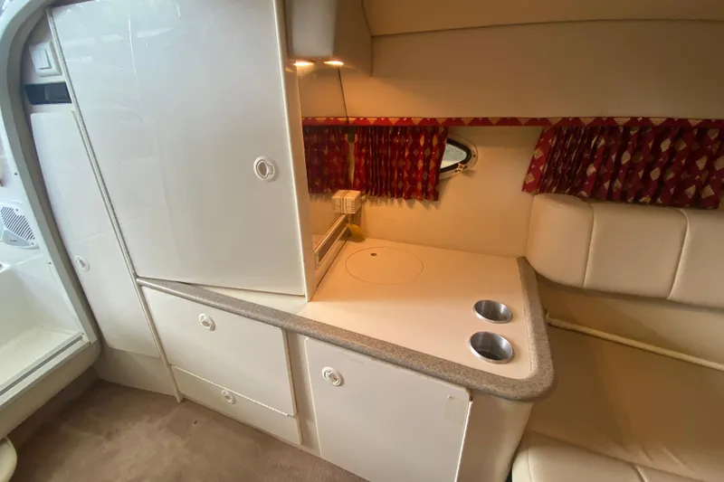 Slide: The Image of Interior of 2001 Formula 330 Sun Sport boat with kitchenette and seating area. - 58