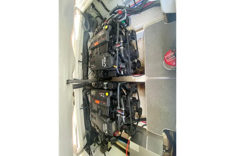 Slide: The Image of Twin engines in a 2001 Formula 330 Sun Sport boat engine compartment. - 47