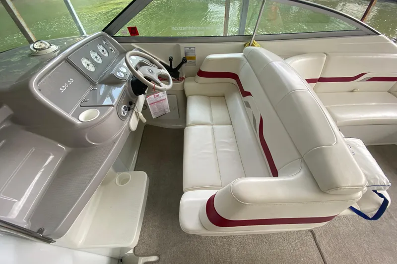 Slide: The Image of Interior of a 2001 Formula 330 Sun Sport boat with white and red seating. - 45