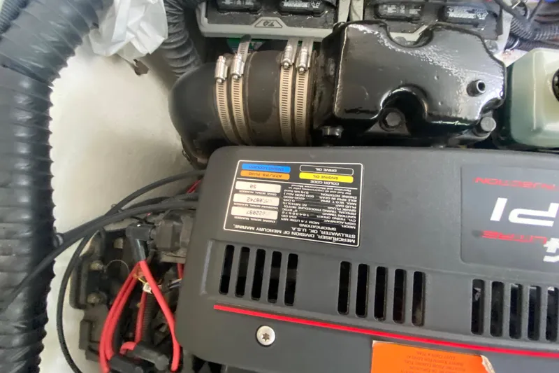 Slide: The Image of Engine compartment of a 2001 Formula 330 Sun Sport boat, showing detailed components and labels. - 51