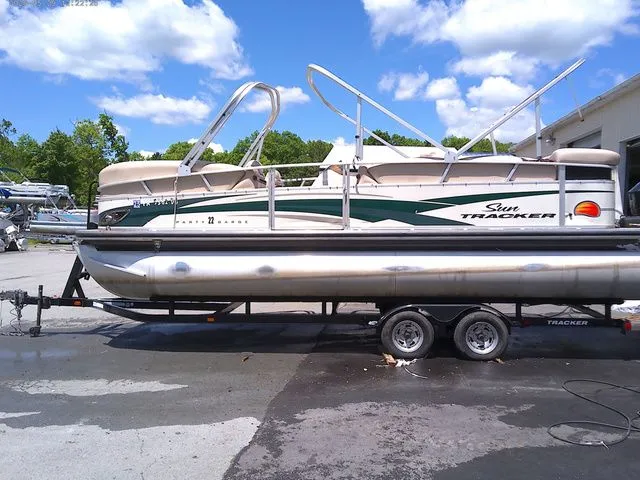 The Image of 2010 Tracker Party Barge 22 pontoon boat on trailer. - 1