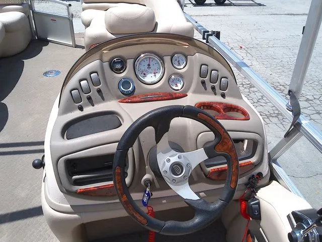 Slide: The Image of Dashboard of a 2010 Tracker Party Barge 22 pontoon boat. - 11