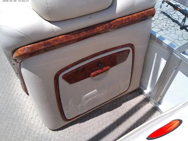 Slide: The Image of Interior of 2010 Tracker Party Barge 22 with wood accents. - 14