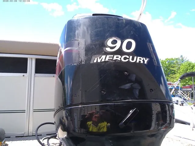 Slide: The Image of Mercury 90 HP outboard motor on 2010 Tracker Party Barge 22. - 3