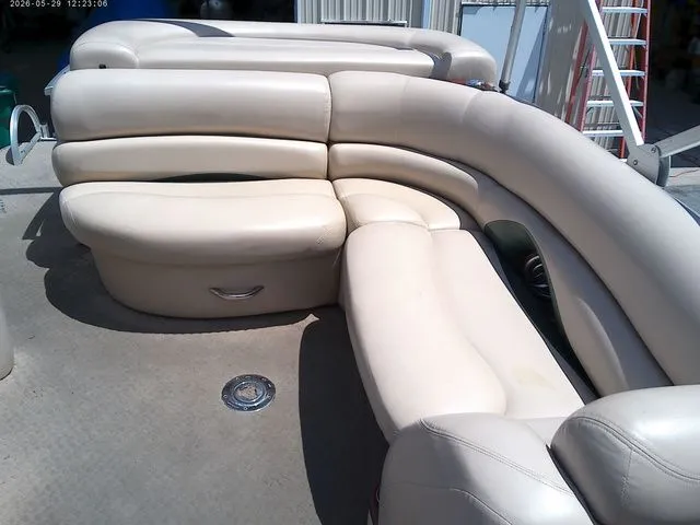 Slide: The Image of 2010 Tracker Party Barge 22 with beige leather seating. - 8