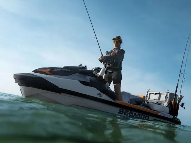 Slide: The Image of Person fishing on a 2026 Sea-Doo FISH PRO on the water. - 2