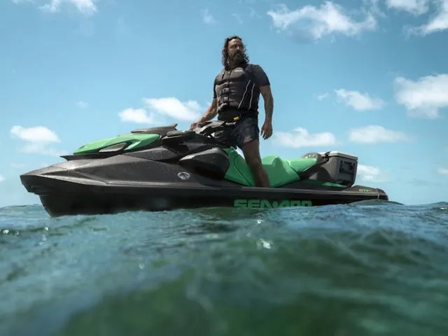 Slide: The Image of Man on Sea-Doo GTI SE 130 jet ski in ocean, 2026 model. - 2