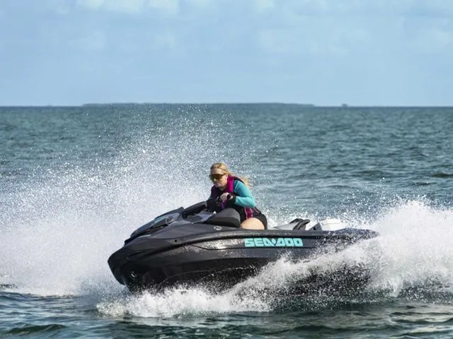 Slide: The Image of Woman riding 2026 Sea-Doo GTR 230 jet ski on the ocean. - 3