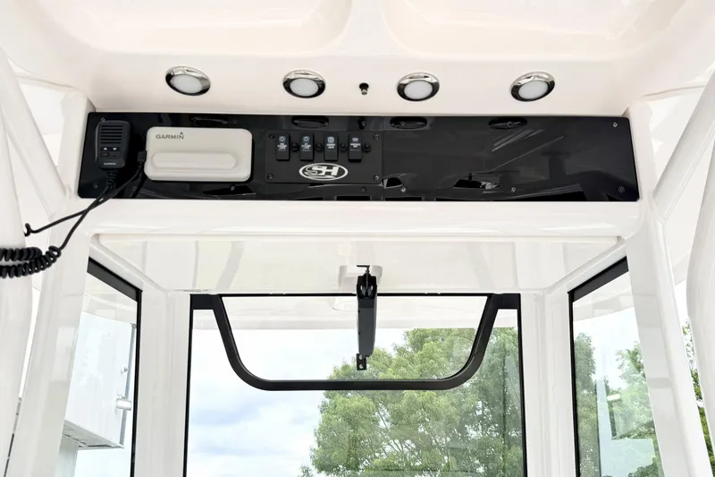 Slide: The Image of 2023 Sea Hunt Escape 28 boat console with Garmin electronics and control panel. - 12