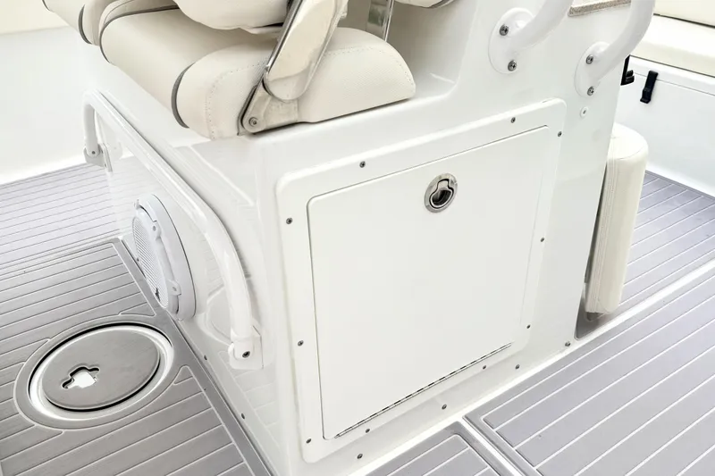 Slide: The Image of 2023 Sea Hunt Escape 28 boat interior with seating and storage compartment. - 17