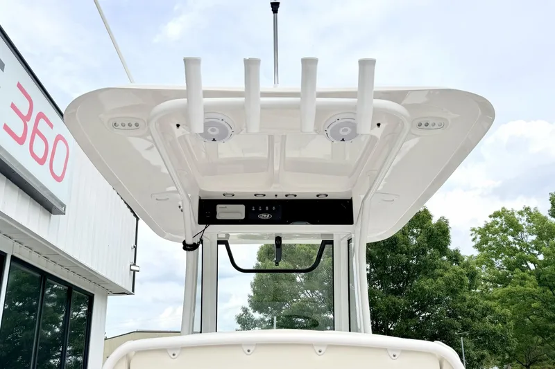 Slide: The Image of 2023 Sea Hunt Escape 28 boat with T-top and rod holders, exterior view. - 5