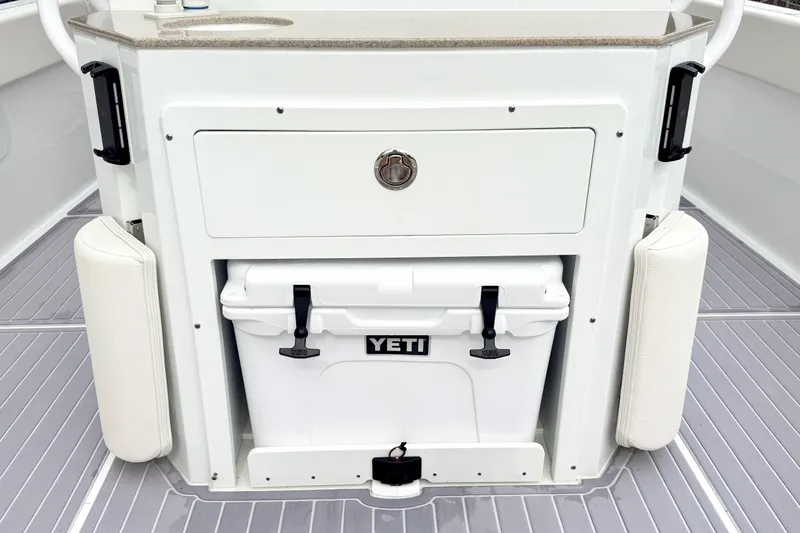 Slide: The Image of 2023 Sea Hunt Escape 28 boat with Yeti cooler and storage compartment. - 7