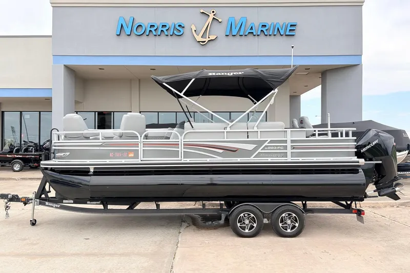 The Image of 2021 Ranger 223FC pontoon boat on trailer at Norris Marine dealership. - 1