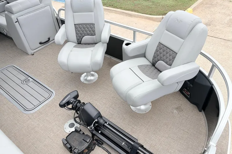 Slide: The Image of 2021 Ranger 223FC boat interior with plush seating and Garmin equipment. - 12
